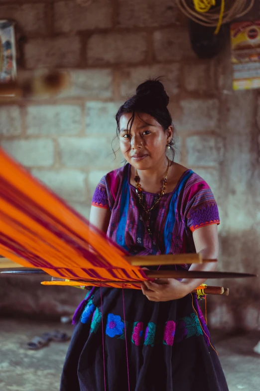 a woman is weaving a piece of cloth, a portrait, pexels contest winner, alanis guillen, avatar image, large)}], multicoloured