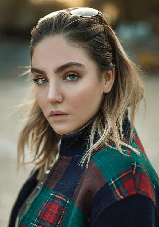 a woman wearing a plaid coat and sunglasses, a colorized photo, inspired by Elsa Bleda, trending on pexels, photorealism, big eyebrows, annasophia robb, madison beer girl portrait, looking from shoulder