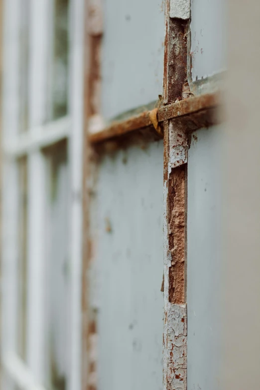 a close up of a window on a building, unsplash, portrait of a slightly rusty, wooden fence, squares, 50mm photograph
