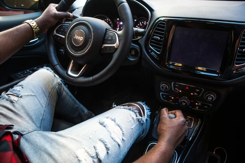 a man sitting in the driver's seat of a car, trending on unsplash, wearing jeans, square, jeep, 2 0 % pearlescent detailing