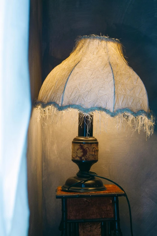 a lamp sitting on top of a table next to a window, renaissance, small finely stippled light, wispy, boudoir