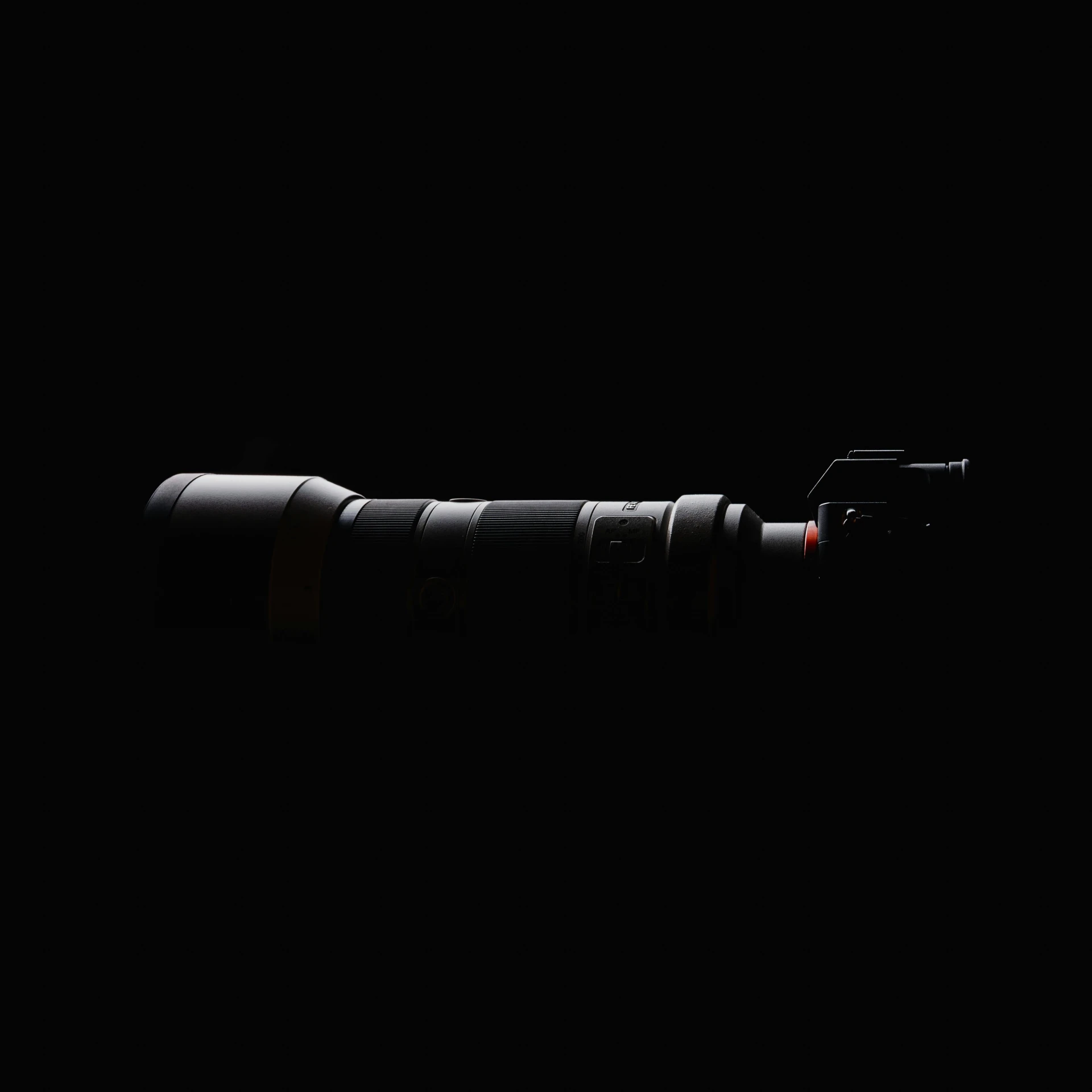 a close up of a camera on a black background, by Tadashi Nakayama, of a lightsaber hilt, canon rf 8 0 0 mm f / 5. 6 l, full body profile camera shot, detailed product image