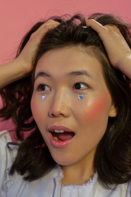 a woman holding her hair in front of her face, inspired by Kim Jeong-hui, trending on reddit, holography, glitter sticker, dewy skin, set on singaporean aesthetic, exhausted face close up