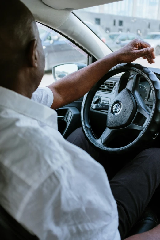 a man sitting in the driver's seat of a car, black man, square, thumbnail, 15081959 21121991 01012000 4k