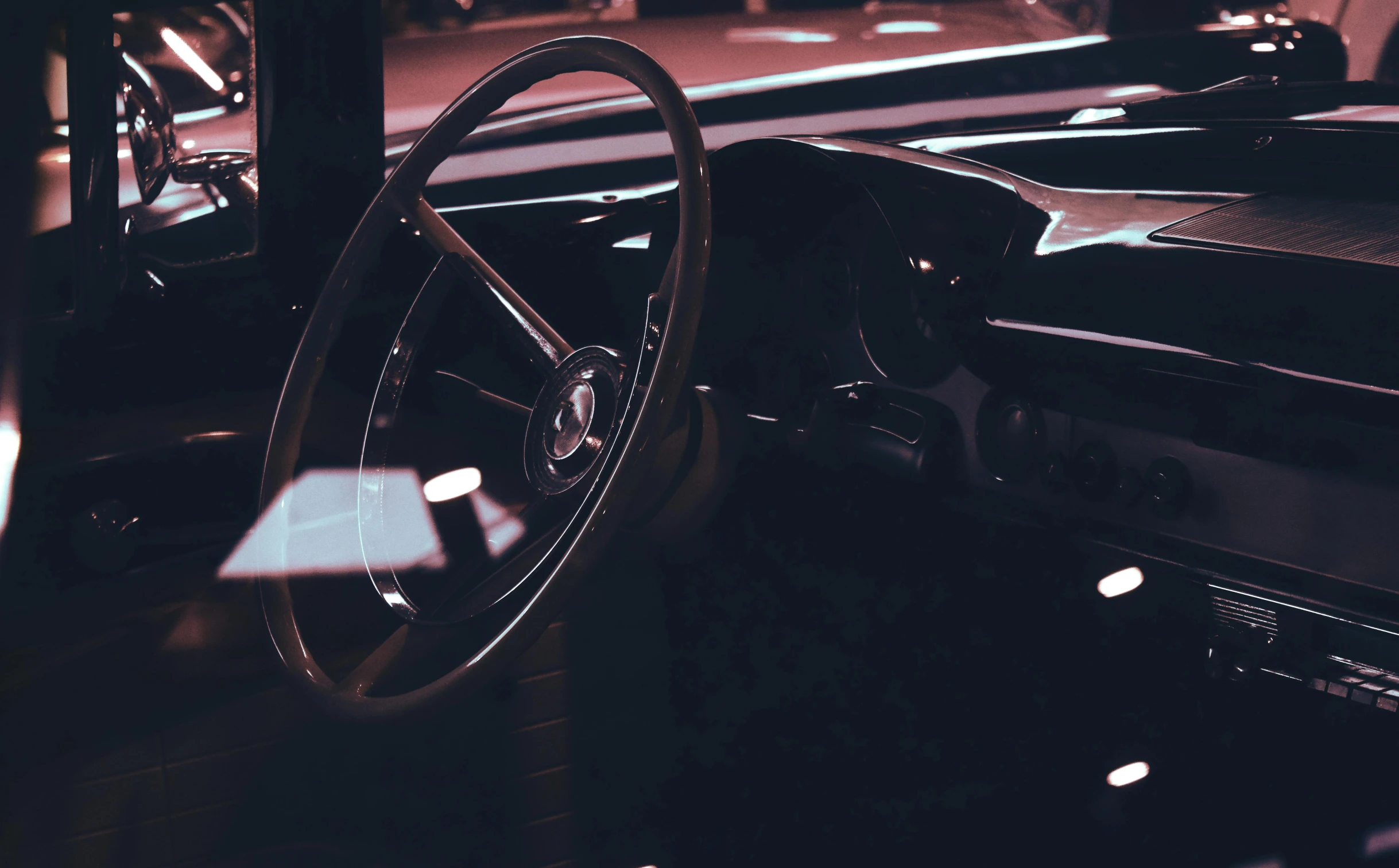 a close up of a steering wheel and dashboard of a car, pexels contest winner, retrofuturism, in a pitch black room, instagram post, 5 0 s aesthetic, lacquered