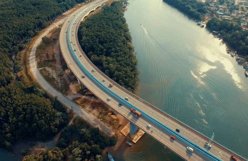 an aerial view of a bridge over a river, by Adam Marczyński, pexels contest winner, cars on the road, vray cinematic smooth, 15081959 21121991 01012000 4k, thumbnail