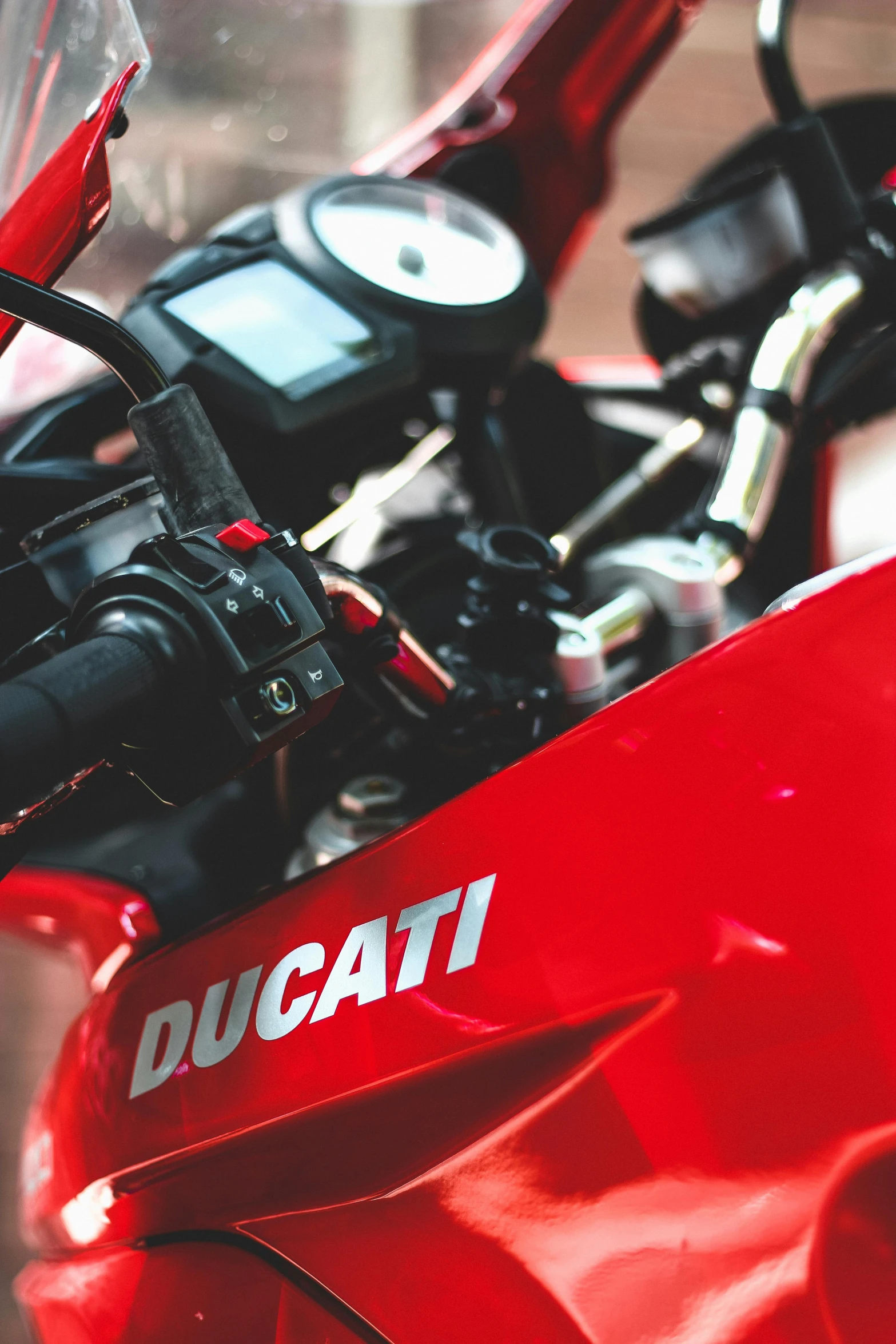 a red ducati motorcycle parked in a parking lot, pexels contest winner, 2 5 6 x 2 5 6 pixels, closeup of arms, indoor shot, controls