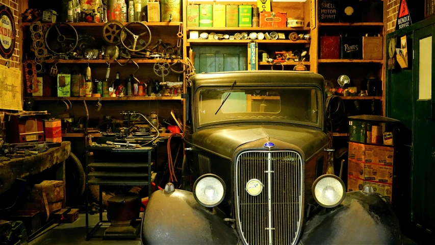 an old car is parked in a garage, a screenshot, pexels contest winner, old home decor, objects well lit, 1 9 3 0 s, australian