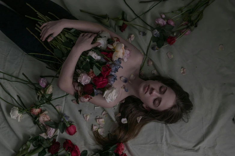 a woman laying on a bed covered in flowers, an album cover, inspired by Elsa Bleda, pexels contest winner, renaissance, roses in hands, sydney sweeney, corpses, ignant