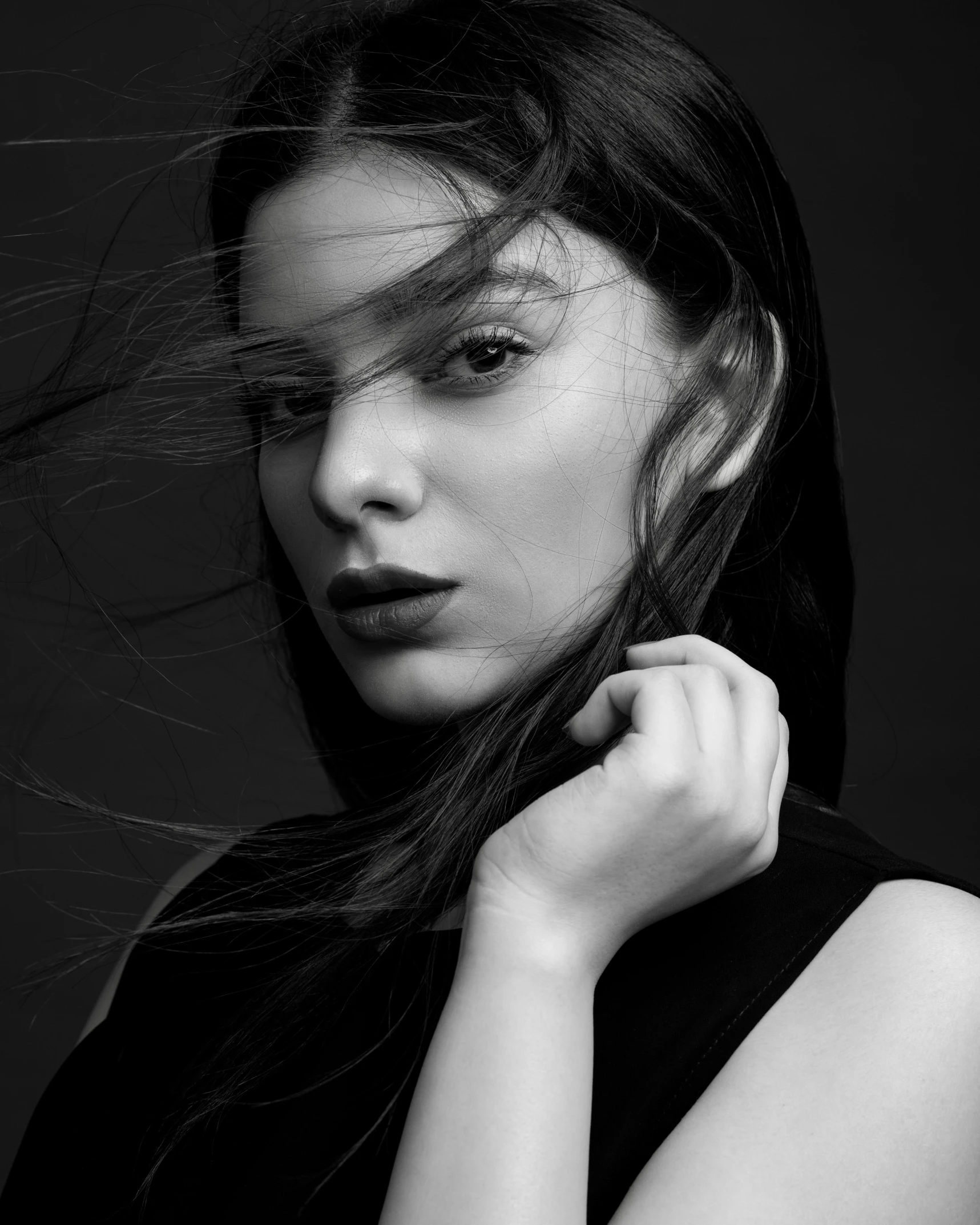 a black and white photo of a woman with long hair, by Zofia Stryjenska, pexels contest winner, hailee steinfeld, lean sleek styling, windblown dark hair, artem chebokha