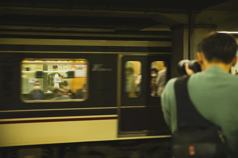 a group of people waiting to board a train, by Elsa Bleda, unsplash, dusty abandoned shinjuku, 90s photo, realistic. 4 k, 🚿🗝📝