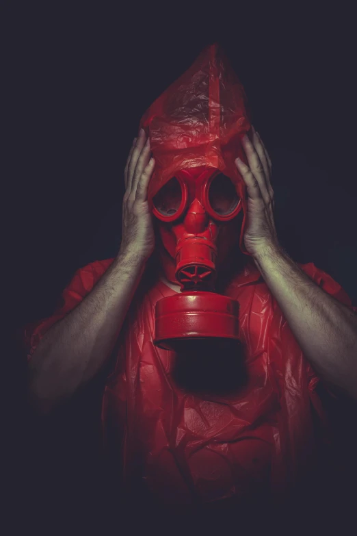 a man in a red gas mask covering his face, an album cover, pexels contest winner, contaminated, surgeon, insidious, chemistry
