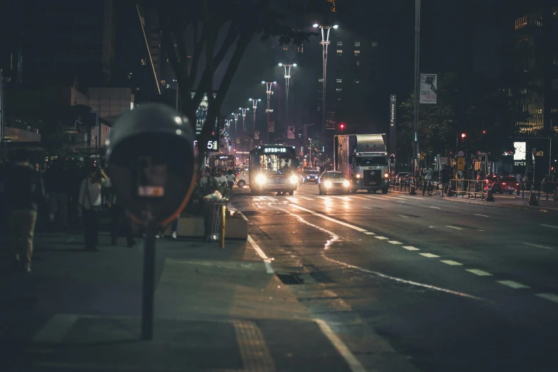a city street filled with lots of traffic at night, pexels contest winner, dark city bus stop, instagram picture, clean streets, in a tropical and dystopic city