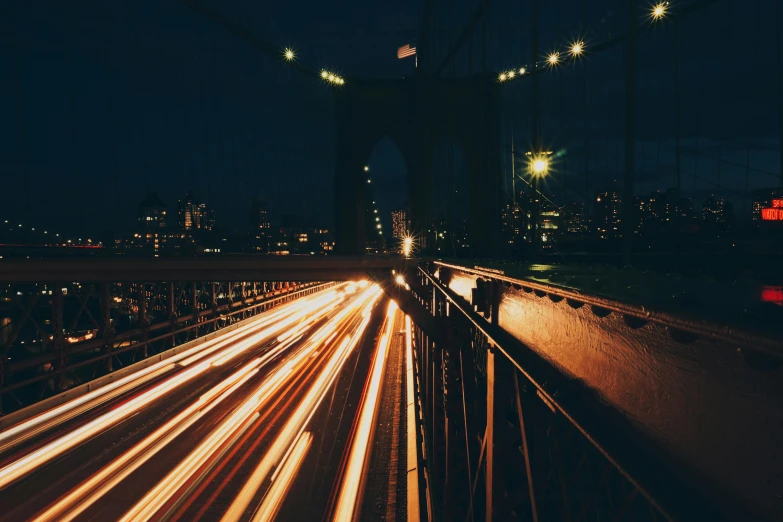 a view of a city at night from a bridge, unsplash contest winner, visual art, speed lines, new york streets, instagram post, bright thin wires