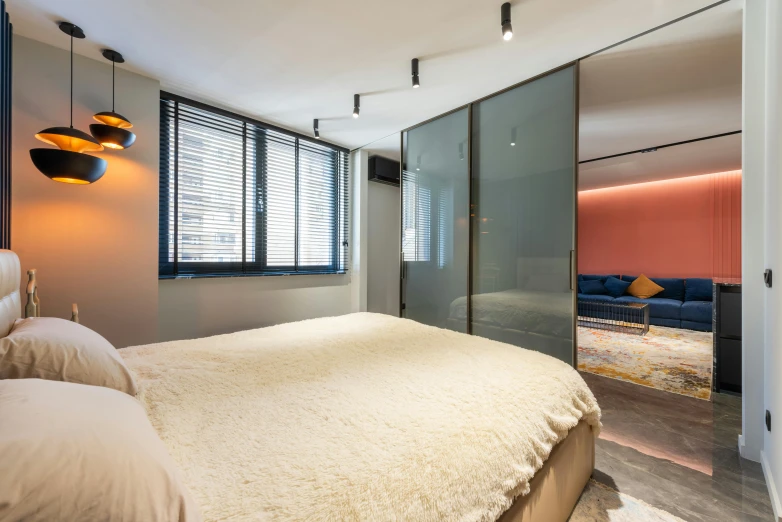 a bed room with a neatly made bed, by Emanuel Witz, unsplash, light and space, nesting glass doors, blue and pink accents, city apartment, lit. 'the cube'