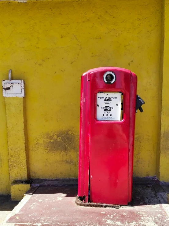 a red gas pump in front of a yellow wall, an album cover, pexels contest winner, street art, indonesia, postage, square, singapore ( 2 0 1 8 )