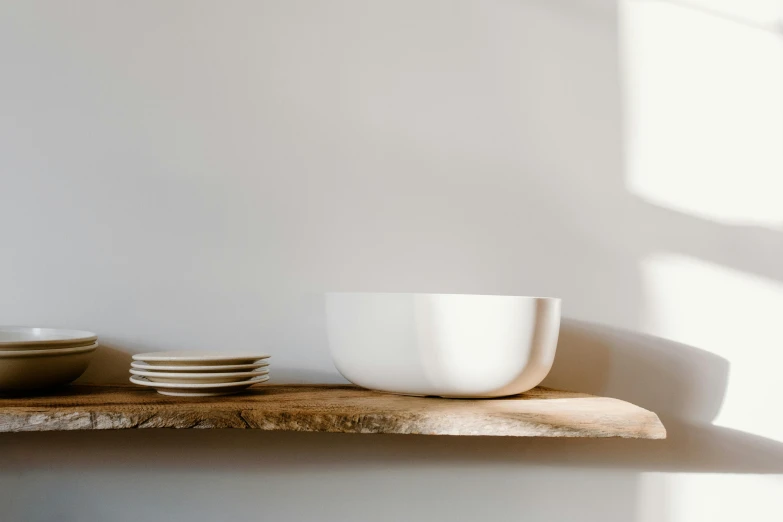 a white bowl sitting on top of a wooden shelf, inspired by William Berra, minimalism, grey, light wood, ultra wide, curved