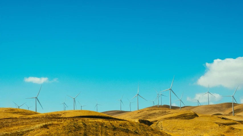 a group of wind turbines sitting on top of a hill, pexels contest winner, sky blue, high grain, unsplash photography, new zealand