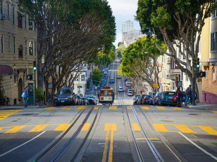 a street filled with lots of traffic next to tall buildings, pexels contest winner, renaissance, photograph of san francisco, trams, background image, square