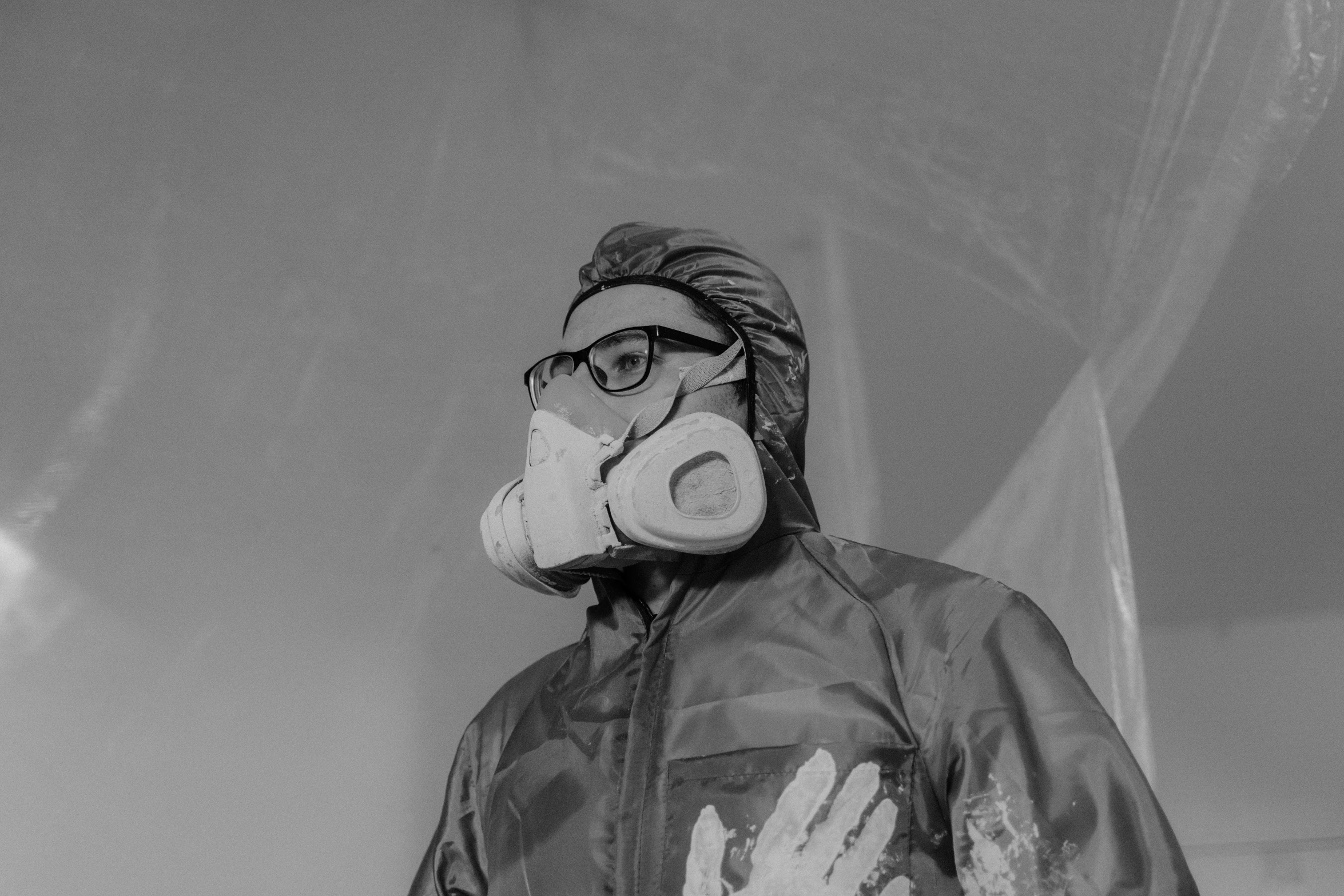 a black and white photo of a man wearing a gas mask, a black and white photo, pexels, ditigal painting, background image, under repairs, decoration