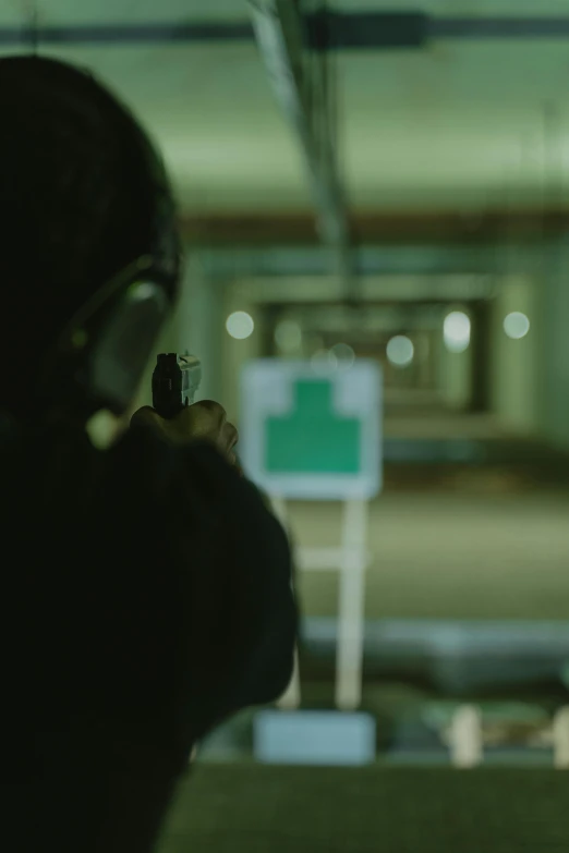 a person holding a gun in a parking garage, shot on anamorphic lenses, pictured from the shoulders up, bullet tracers, performance