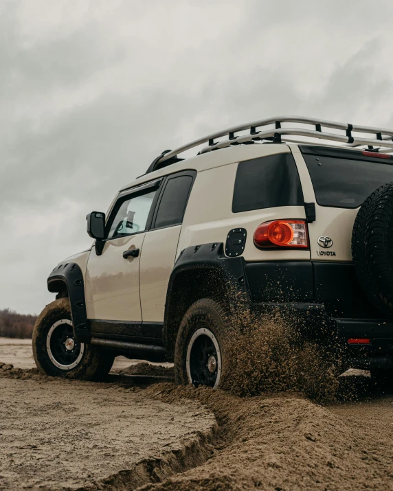 a white suv driving down a dirt road, rugged details, intimidating floating sand, unsplash photography, full body close-up shot