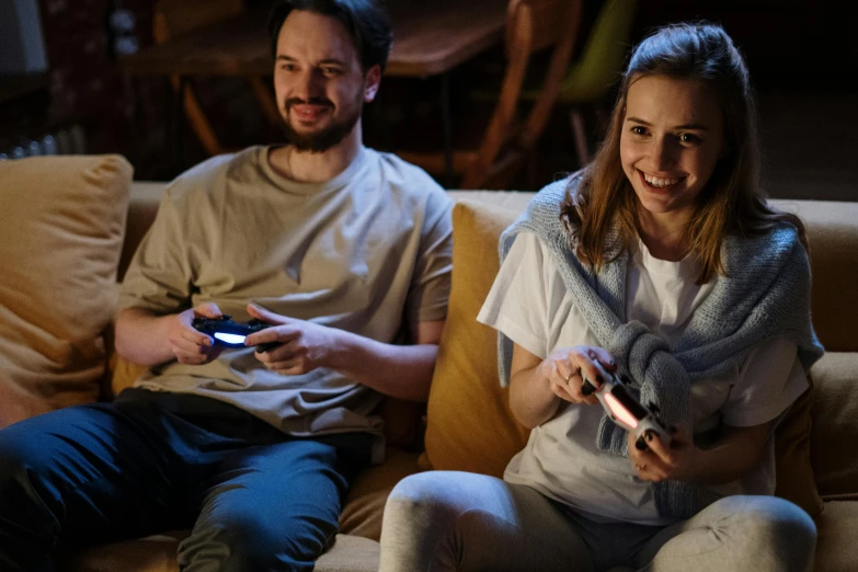 a man and a woman sitting on a couch playing video games, profile image, instagram post, game resources, early evening