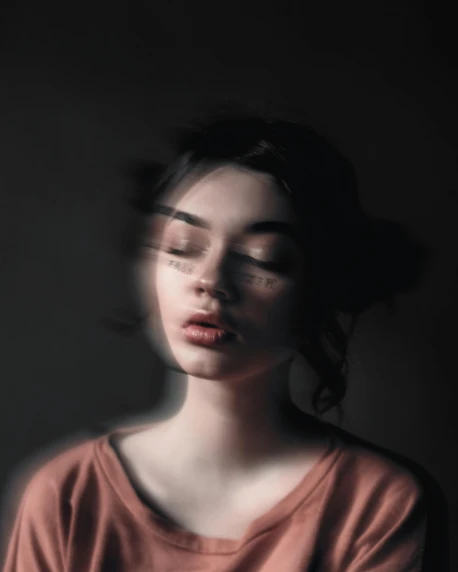 a woman with her eyes closed in a dark room, trending on pexels, surrealism, blurry and glitchy, on a gray background, photo of the girl, wiggly ethereal being