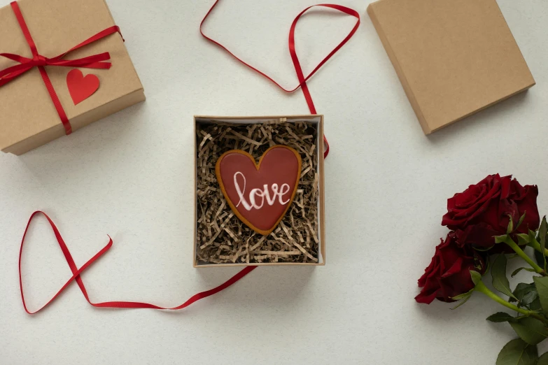 a box that has a heart shaped cookie in it, inspired by Eden Box, medium level shot, ornament, shot with sony alpha 1 camera, mini model