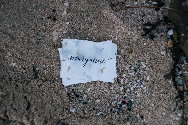 a piece of paper that is on the ground, by Morgan Russell, unsplash, who is born from the sea, mazarineee, your name, elegantly dressed