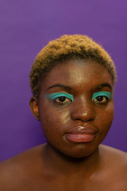 a close up of a person with blue eyes, an album cover, by Stokely Webster, afrofuturism, purple lipstick, green and purple studio lighting, nonbinary model, teal skin