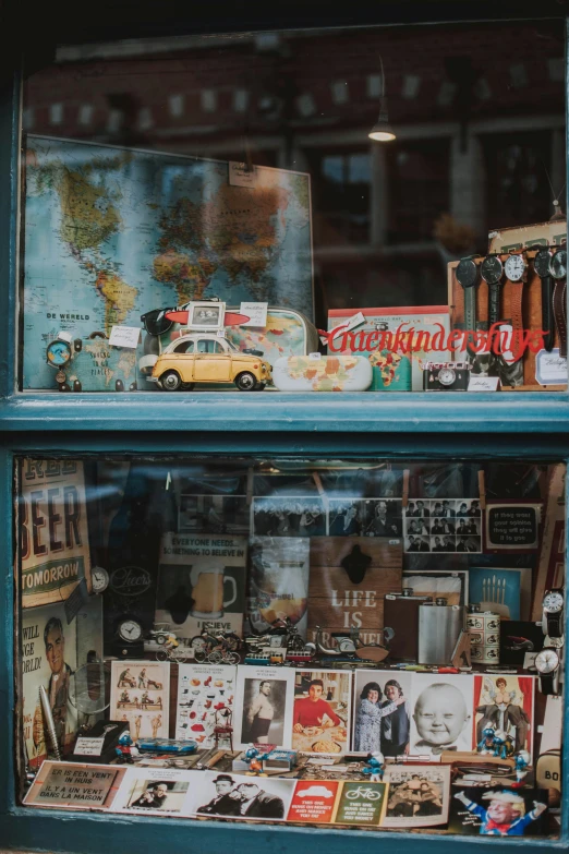 a window that has a bunch of items in it, a picture, pexels contest winner, nostalgic vibes, bookshops, road trip, display case