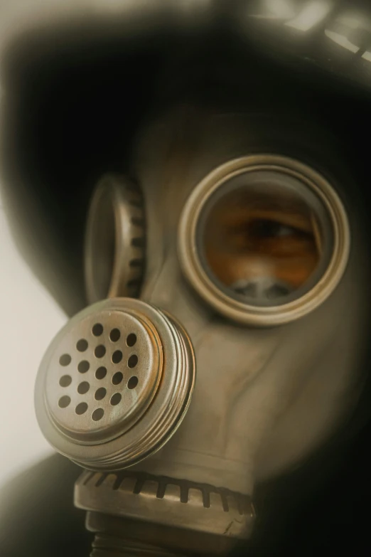 a close up of a person wearing a gas mask, an album cover, flickr, nuclear art, hazy, ultra - realism, oxygen tank, taken in the late 2010s