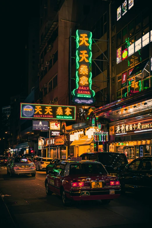 a busy city street at night with neon signs, by Patrick Ching, pexels contest winner, cars parked underneath, traditional chinese, exterior, yellow lights