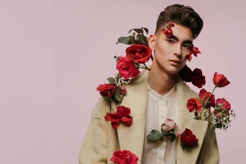 a man with flowers on his head posing for a picture, an album cover, by Valentine Hugo, trending on pexels, romanticism, beautiful androgynous prince, rose twining, model pose, liam brazier and nielly