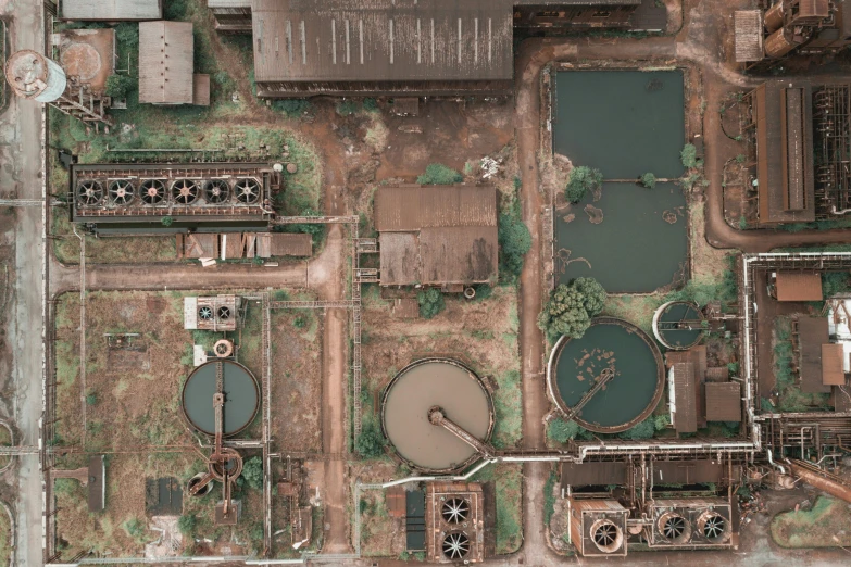 an aerial view of a large industrial area, an album cover, unsplash contest winner, renaissance, dirty water, ((rust)), dirty laboratory, 15081959 21121991 01012000 4k