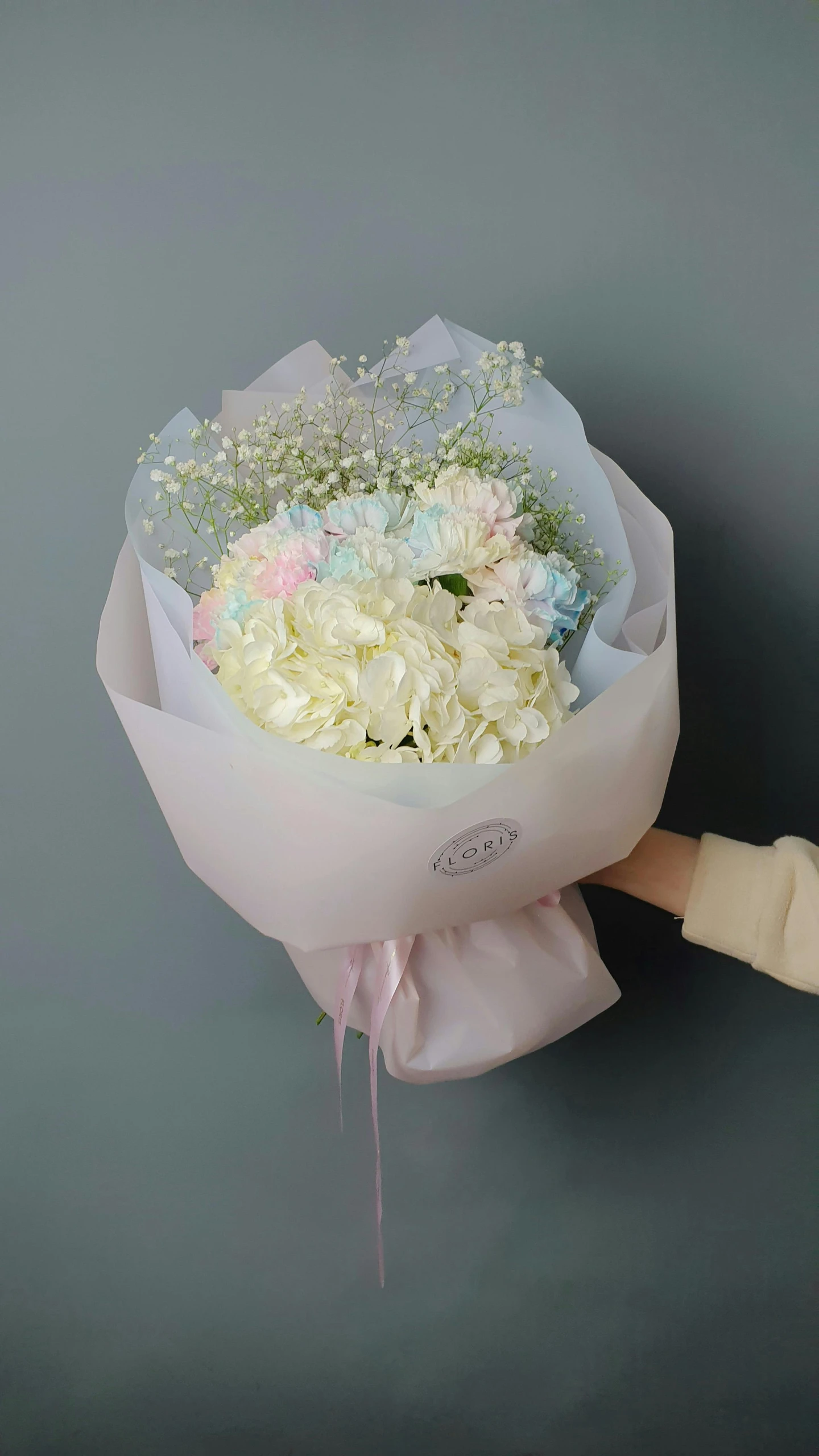 a woman holding a bouquet of white and pink flowers, a pastel, inspired by Cheng Jiasui, instagram, light blue mist, product view, hydrangea, i love you