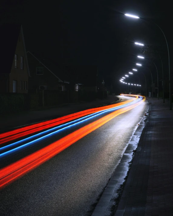 a long exposure photo of a street at night, an album cover, unsplash contest winner, photorealism, rainbow road, ilustration, headlights, photographed for reuters