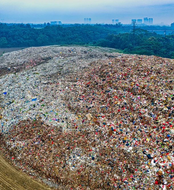 a large pile of garbage sitting in the middle of a field, by Andreas Gursky, reddit, conceptual art, feng zhu |, giant crowd, photo for magazine, panorama