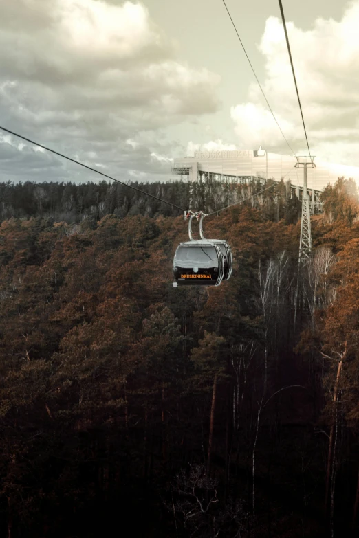 a ski lift going up the side of a mountain, inspired by Filip Hodas, renaissance, espoo, during autumn, trams, grey