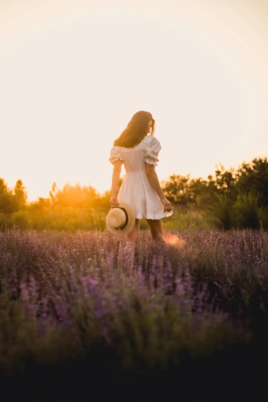 a woman in a white dress standing in a lavender field, pexels contest winner, watching the sunset, soft shadows, 15081959 21121991 01012000 4k, walking away