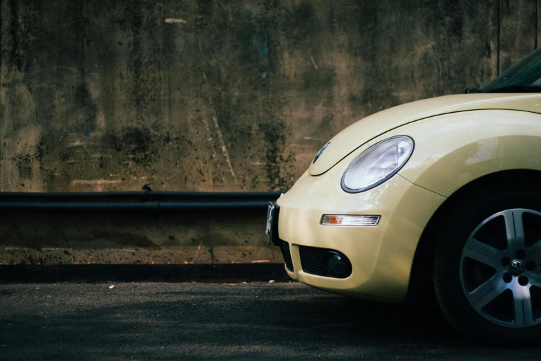 a yellow beetle parked on the side of the road, pexels contest winner, white and yellow scheme, 1 4 9 3, light toned, simple