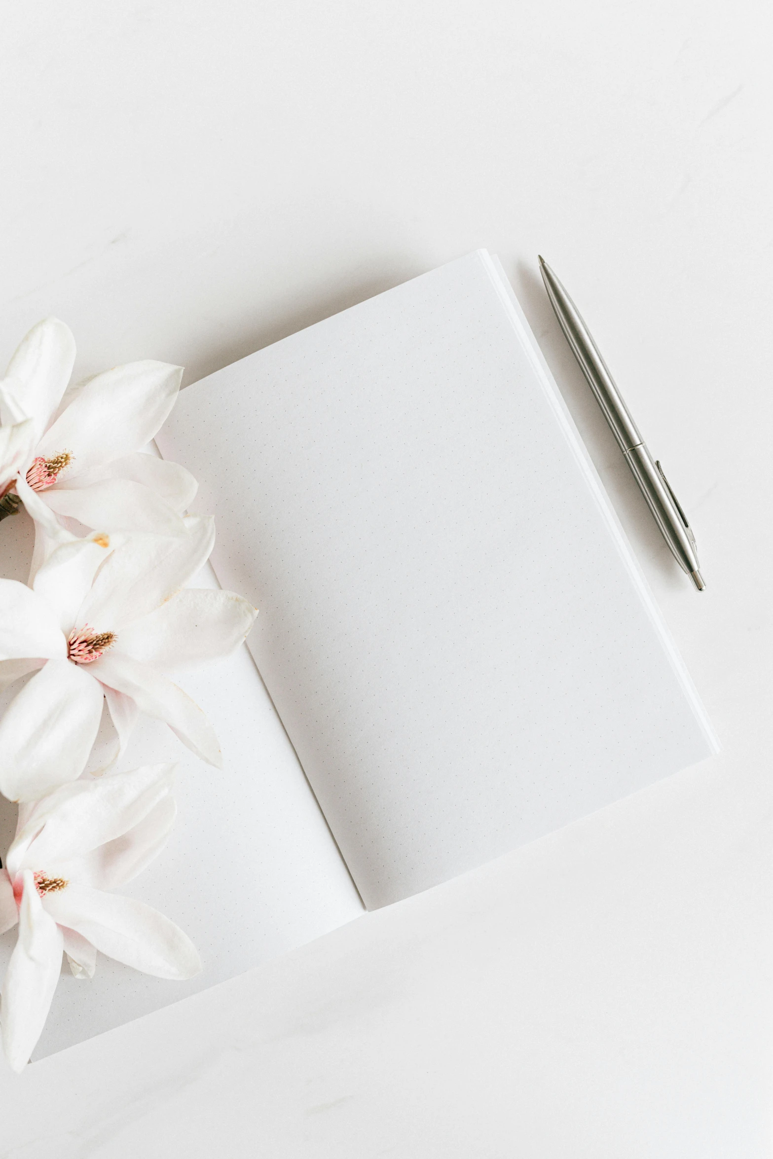 a cup of coffee and a notebook on a white table, by Carey Morris, unsplash contest winner, minimalism, white orchids, thumbnail, wedding, pencil