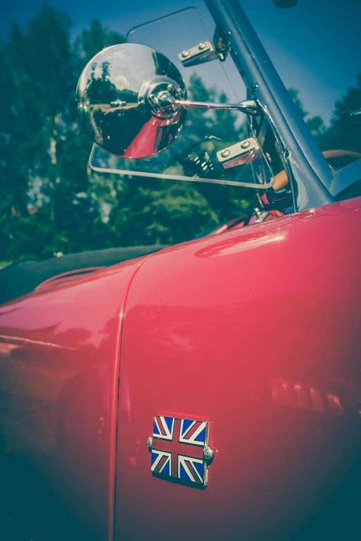 a red car with a british flag sticker on it, a picture, by Sven Erixson, pexels contest winner, fine details portrait, soft top, today\'s featured photograph 4k, summer 2016