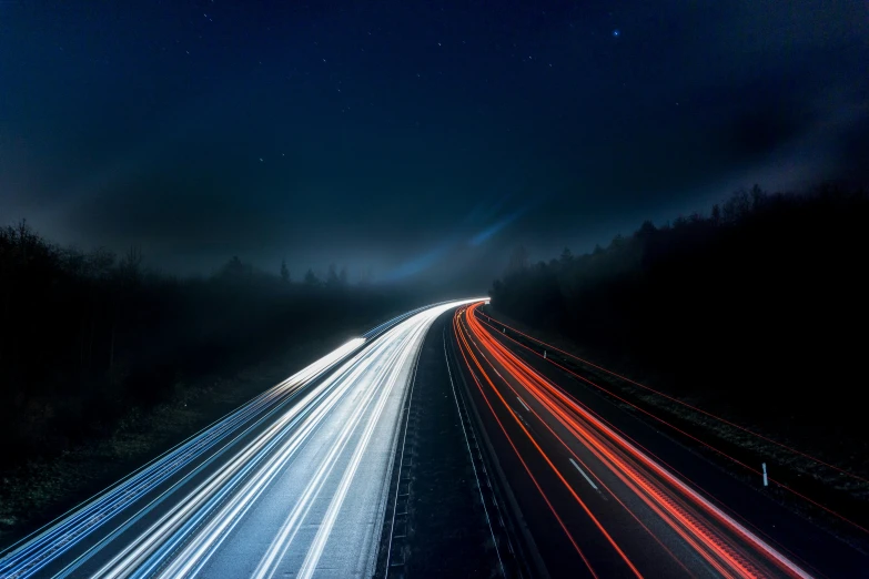 a long exposure photograph of a highway at night, by Adam Szentpétery, unsplash, mikko lagerstedt, multicoloured, illustration, multiple stories