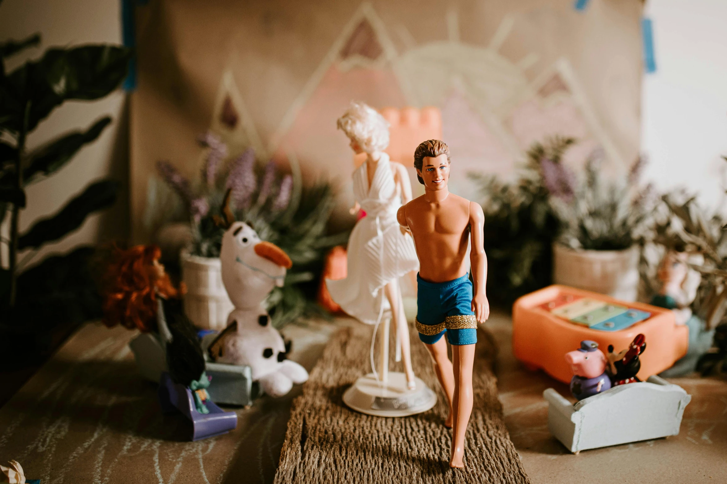 a couple of figurines sitting on top of a table, by Lee Loughridge, pexels contest winner, barbie doll in panties and bra, frozen ii klaus film, holy themed, crafts and souvenirs