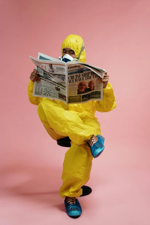 a man in a yellow suit reading a newspaper, by Rachel Reckitt, trending on reddit, happening, staff wearing hazmat suits, promo photo, adult swim, plague and fever. full body