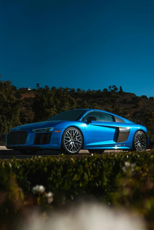 a blue sports car parked on the side of a road, by Austin English, pexels contest winner, an ultra realistic 8k octa photo, southern california, medium shot photo 8k ultrahd, full body shot 4k