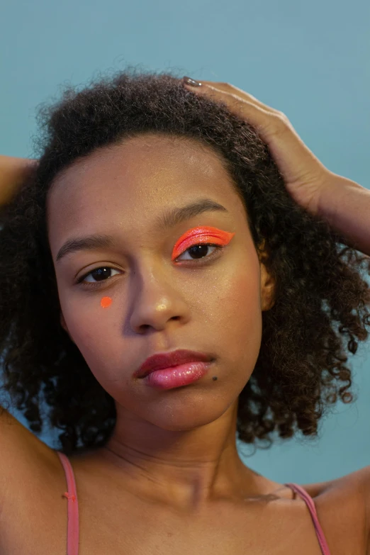 a close up of a person with bright makeup, an album cover, by Lily Delissa Joseph, light red and orange mood, model posing, (((neon palette))), mixed race