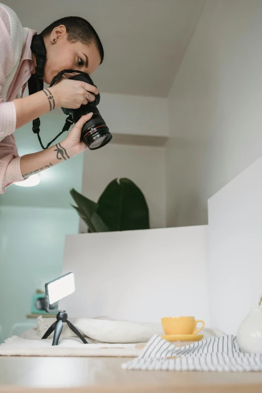 a woman taking a picture of herself in a mirror, trending on pexels, photorealism, dslr photo of a vase on a table, cinematic outfit photo, headshot profile picture, in white room